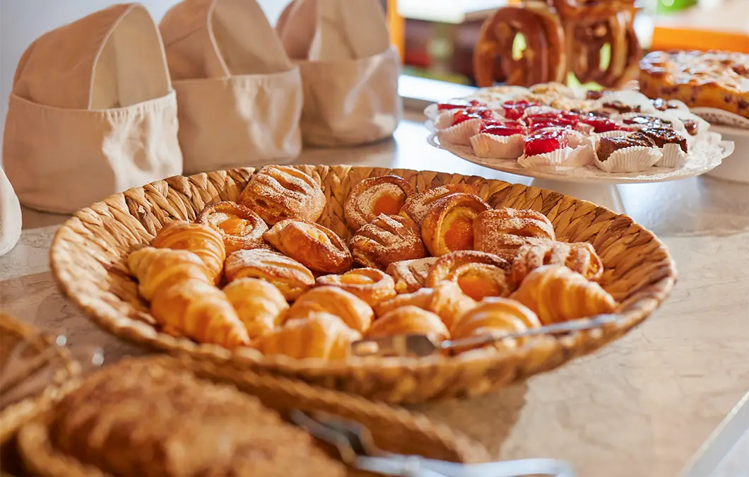 Breakfast buffet with pastries and spreads at Hotel Präsident München